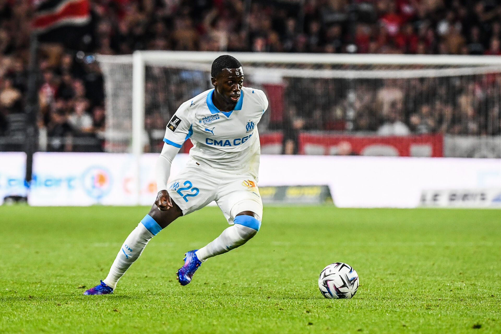 Timothy Weah in action in the Olympique Marseille home kit